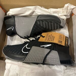 Black and gray Nike Metcon weightlifting shoes